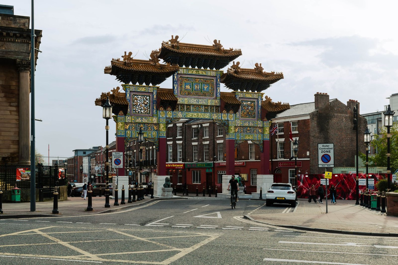 Traditional Chinese archway in Liverpool's Chinatown, displaying vibrant architecture.