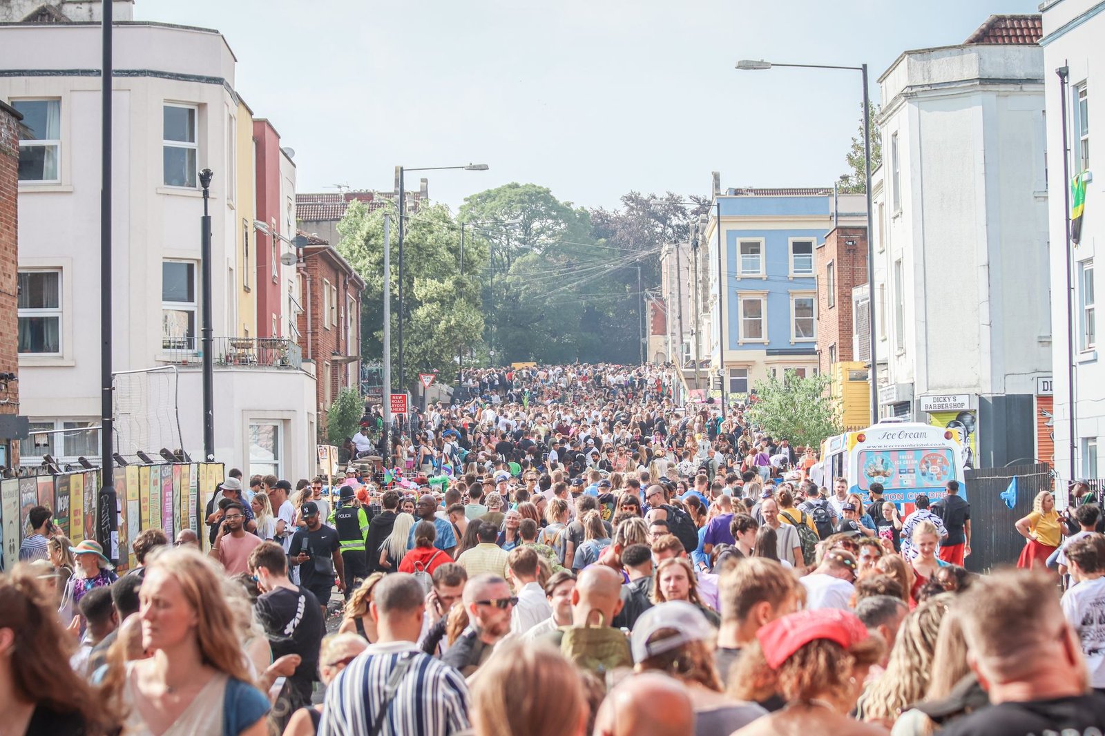 Vibrant crowd fills the streets of Bristol during a lively outdoor festival.