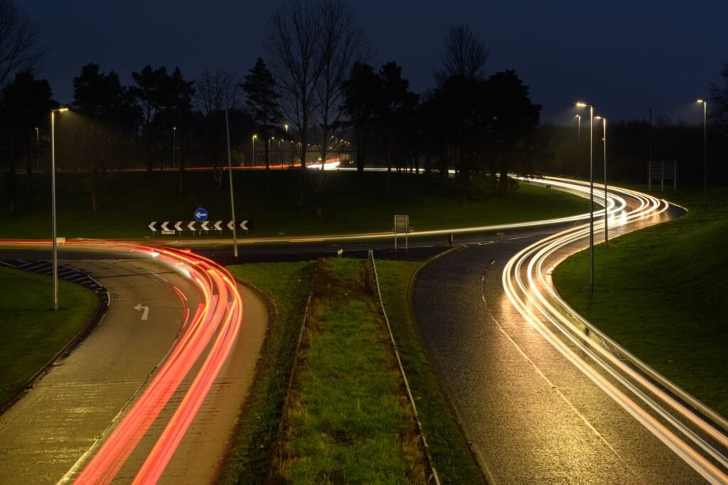Long exposure of night traffic creating light trails on a roundabout in Craigavon, UK.