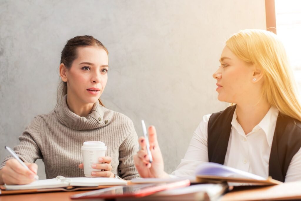 Two adults discussing evening plans in a quiet Swindon café