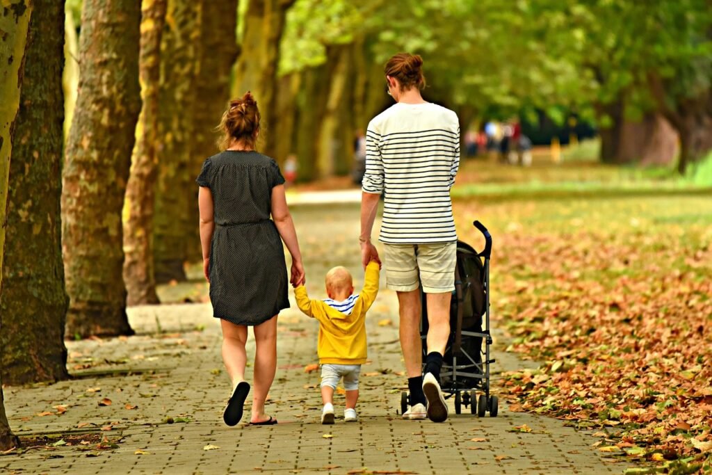 family, love, outdoors, woman, man, parents, parenthood, together, walking, park, father, mother, child, kid, care, leisure,