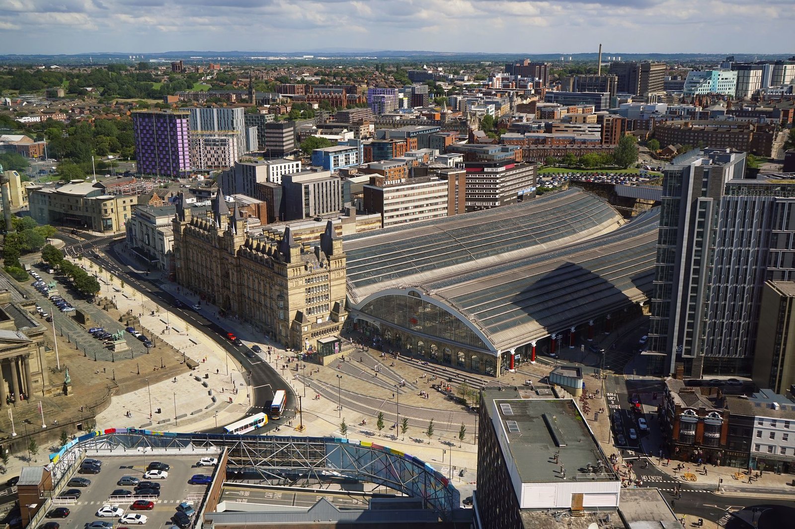 Explore the vibrant architecture of Liverpool with this stunning aerial shot showcasing Lime Street Station.