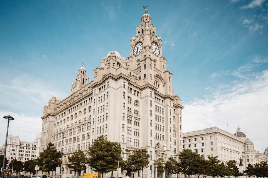 Stunning view of Liverpool's Royal Liver Building under a clear blue sky.