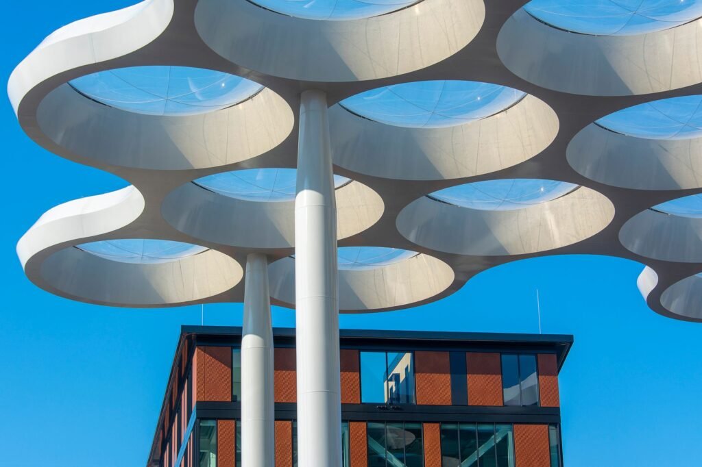 Striking modern architectural detail captured against a clear blue sky in Utrecht, Netherlands.
