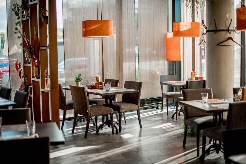 Cozy restaurant interior featuring elegant decor and warm lighting.
