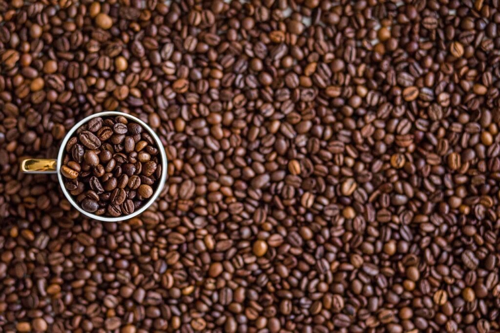 coffee, coffee beans, cup, mug, beans, roasted, coffee cup, roasted coffee, roasted coffee beans, brown, caffeine, food, cafe
