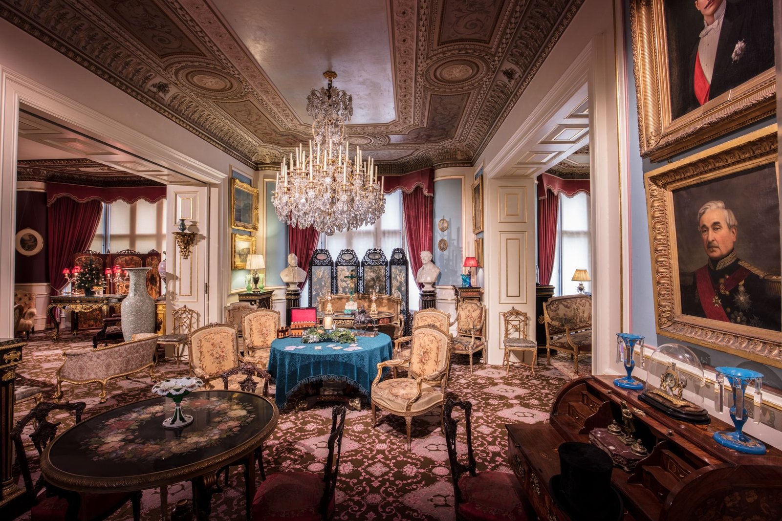 A beautifully decorated historic drawing room featuring opulent furnishing and architectural details.