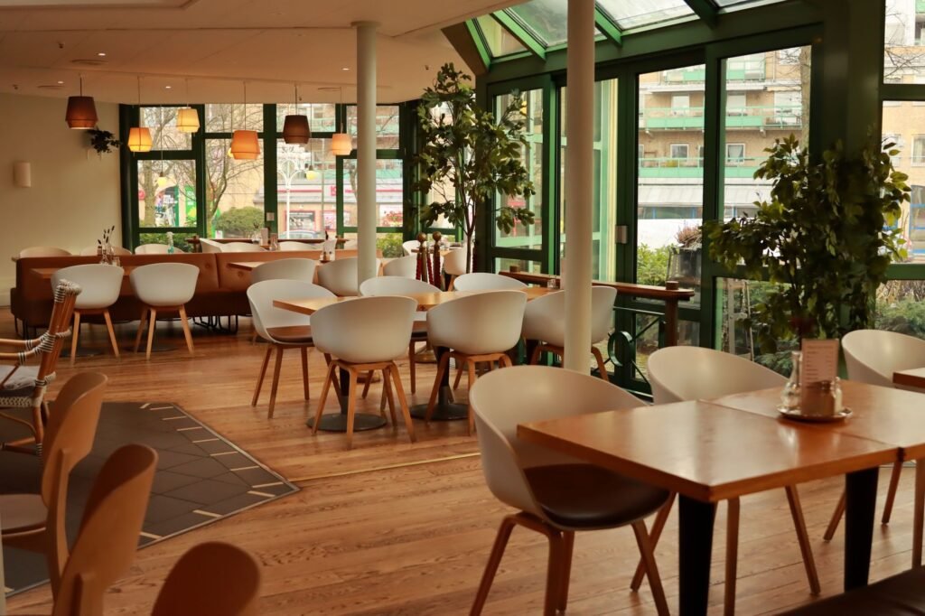 Bright Scandinavian-style restaurant interior with chairs and tables in Gothenburg, Sweden.