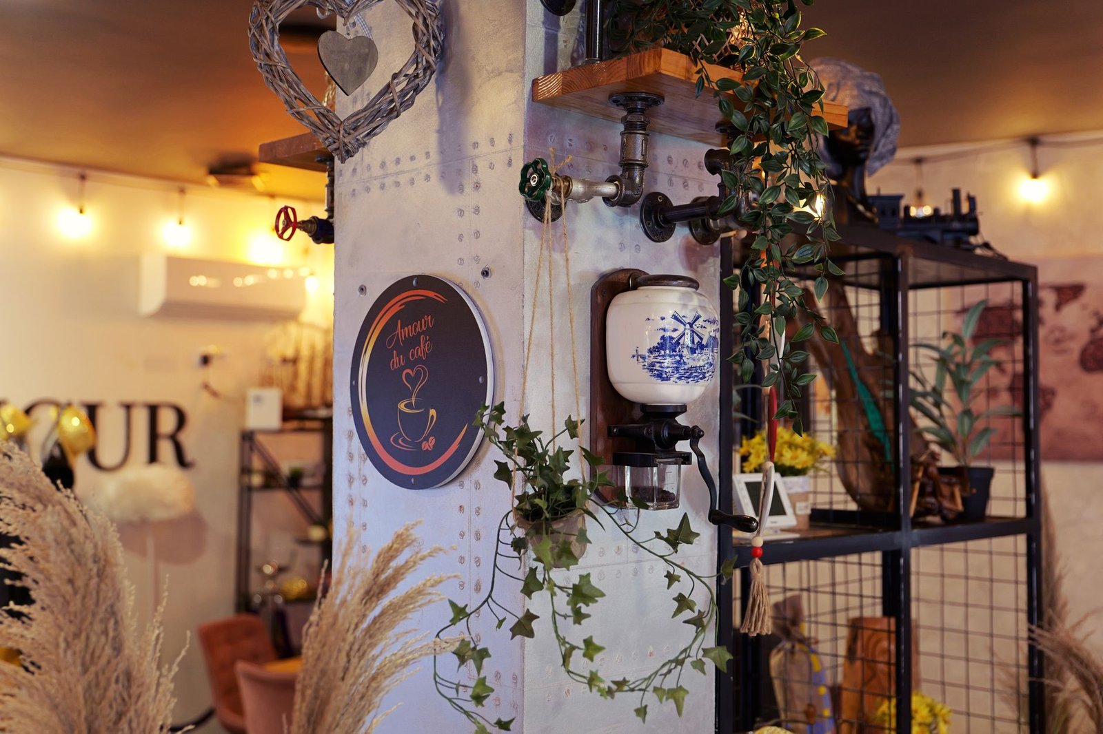A charming café interior with vintage decor, plants, and warm lighting creating a cozy atmosphere.