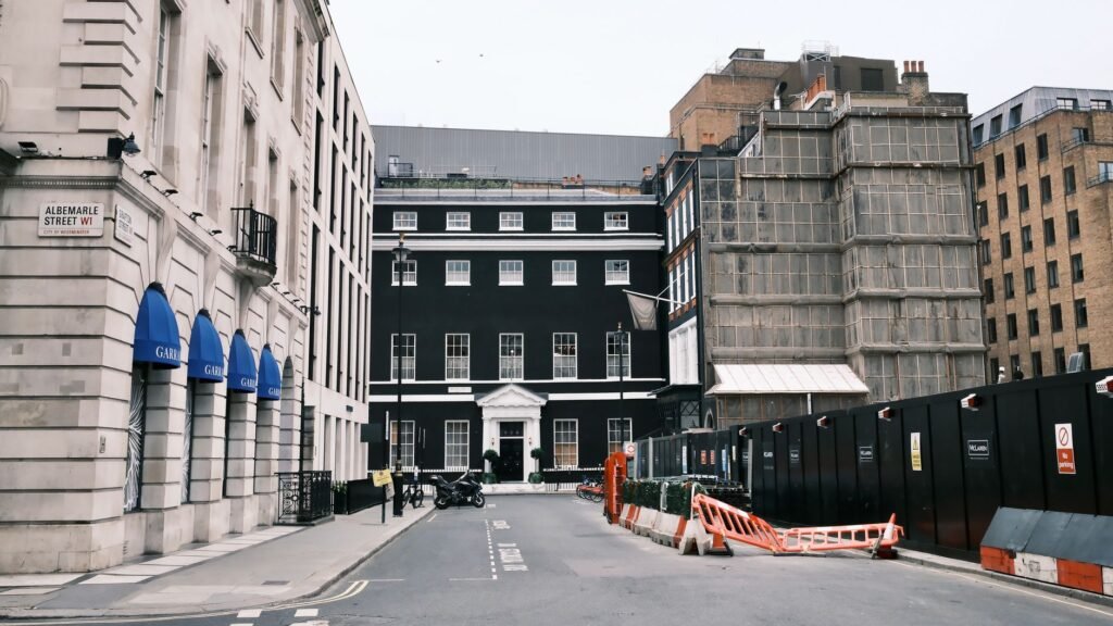 Street view of Albemarle Street, London with classic architecture.