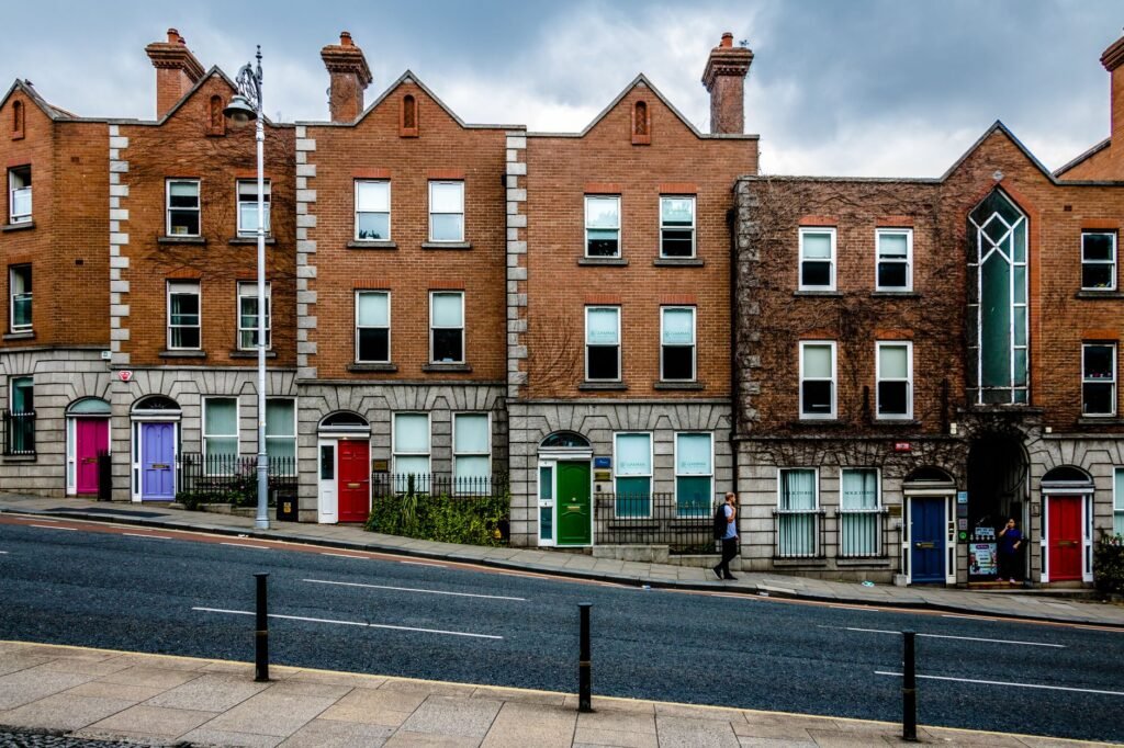 Colorful Georgian-style buildings line a street in Dublin, Ireland, showcasing classic architecture.