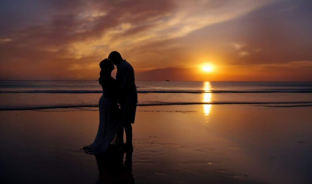A romantic couple sharing an intimate moment on a beach during sunset.