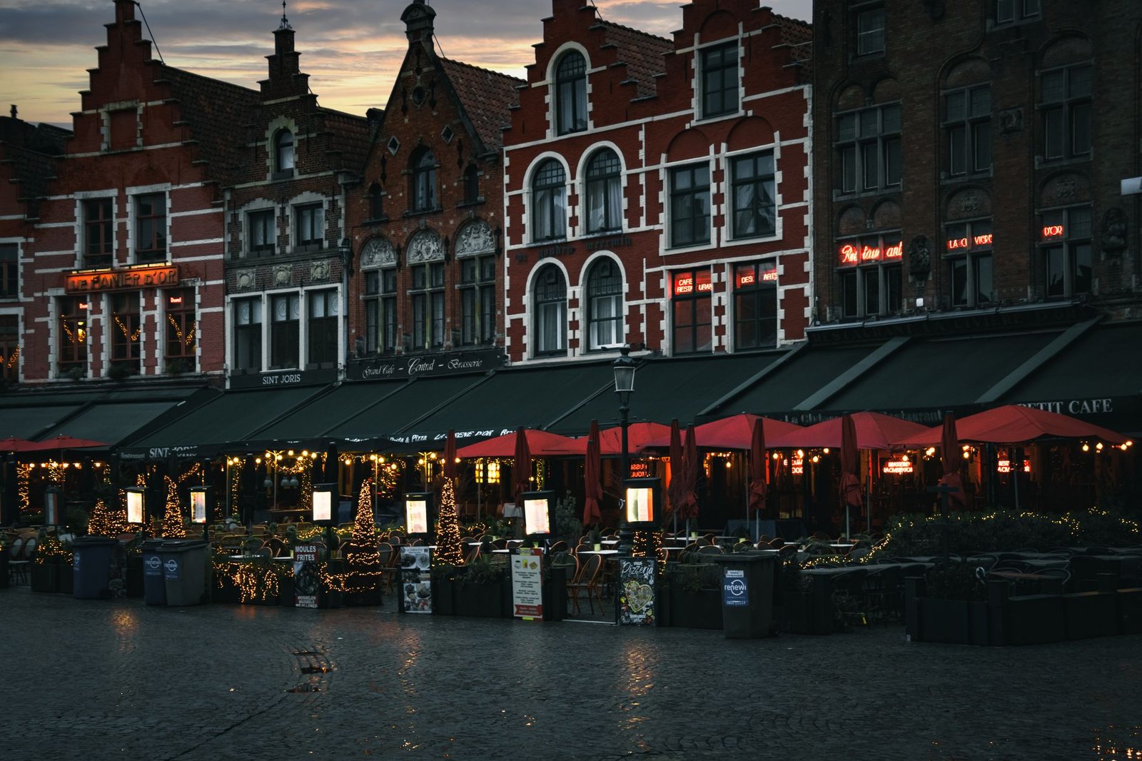 Explore the charming evening atmosphere of old town square cafes, featuring historic architecture and inviting lights.