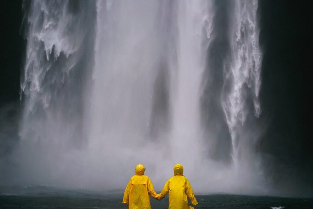 couple, holding hands, people, nature, raincoat, selective color, water, waterfalls, yellow, happyvalentine's