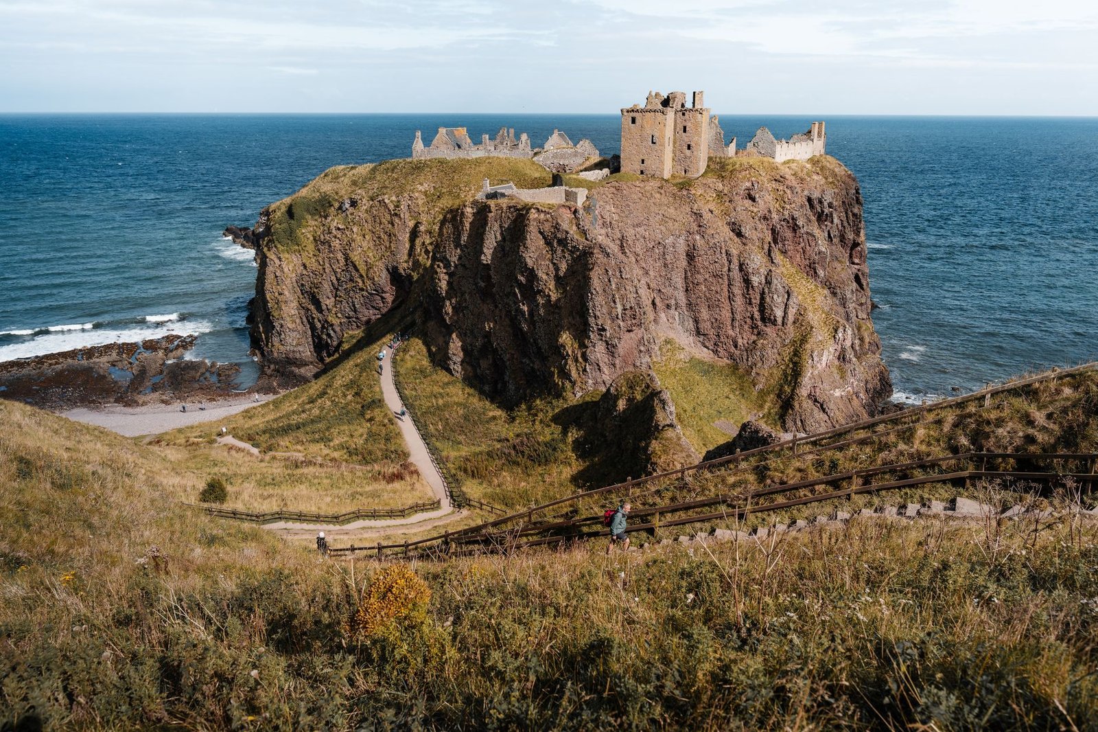 Scenic view of Dunnottar Castle perched on a coastal cliff in Scotland.