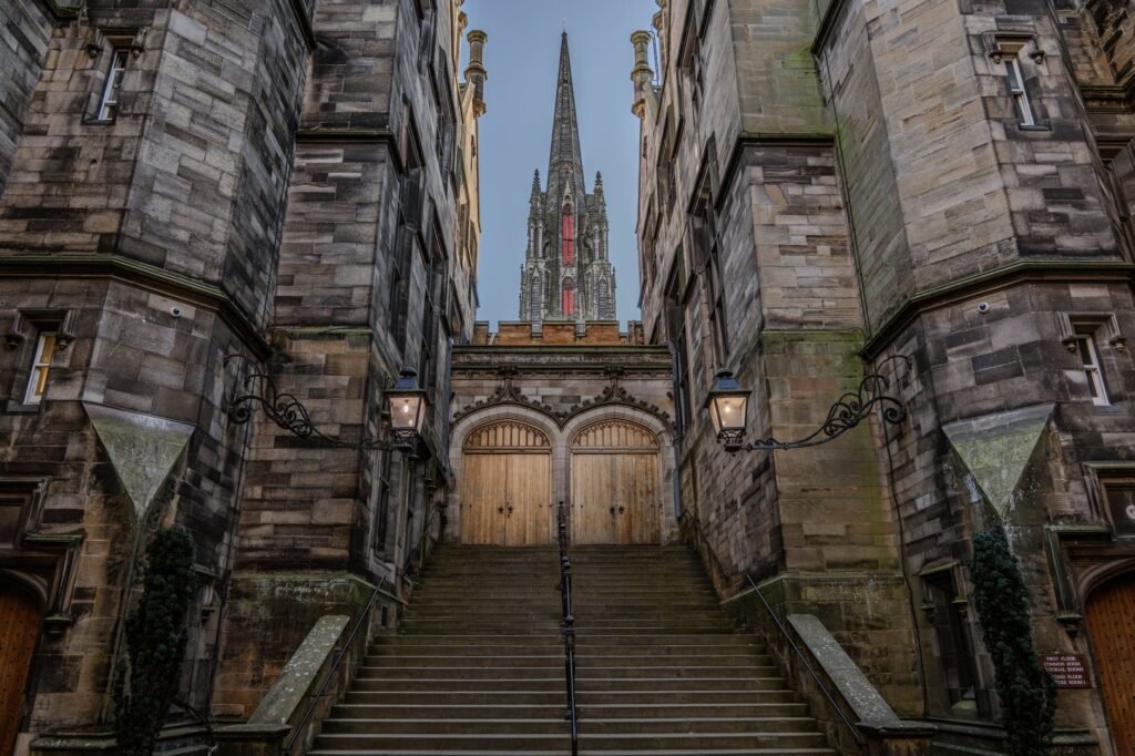 Captivating view of historic stone architecture in Edinburgh featuring iconic spire.