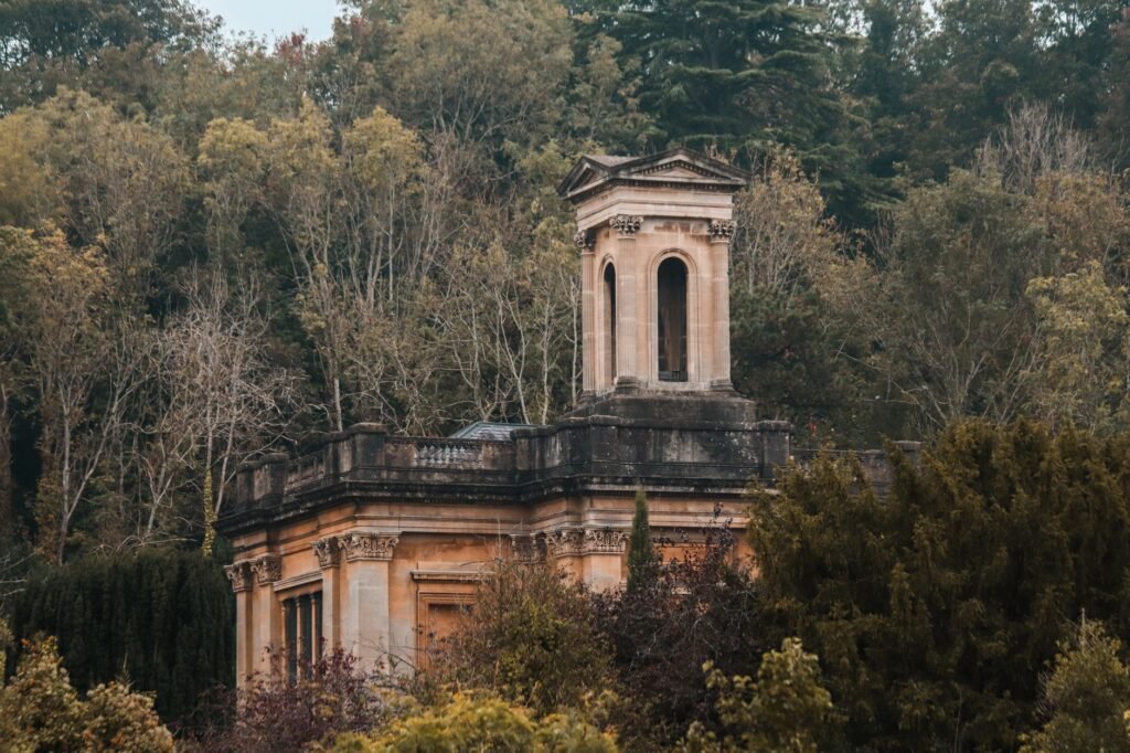 A vintage tower nestled in a dense forest landscape, Bristol, England.