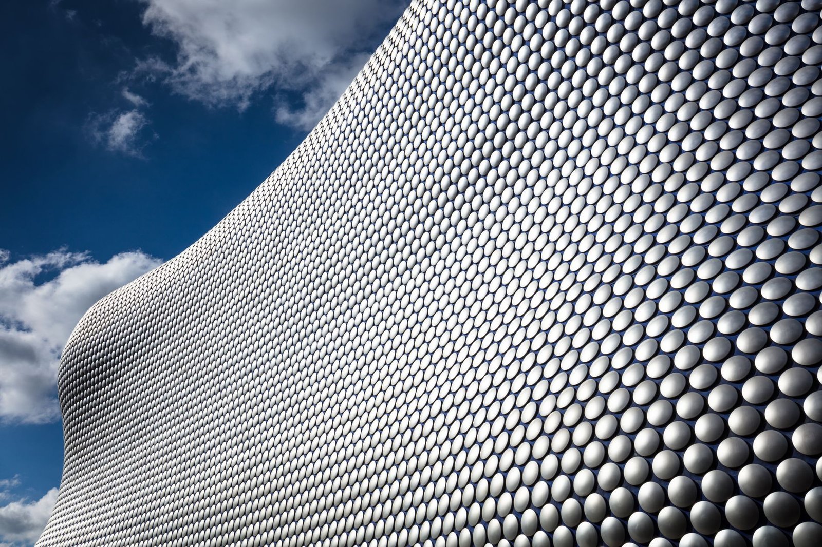 A striking view of the Selfridges building in Birmingham, showcasing its modern architectural design with unique patterns.
