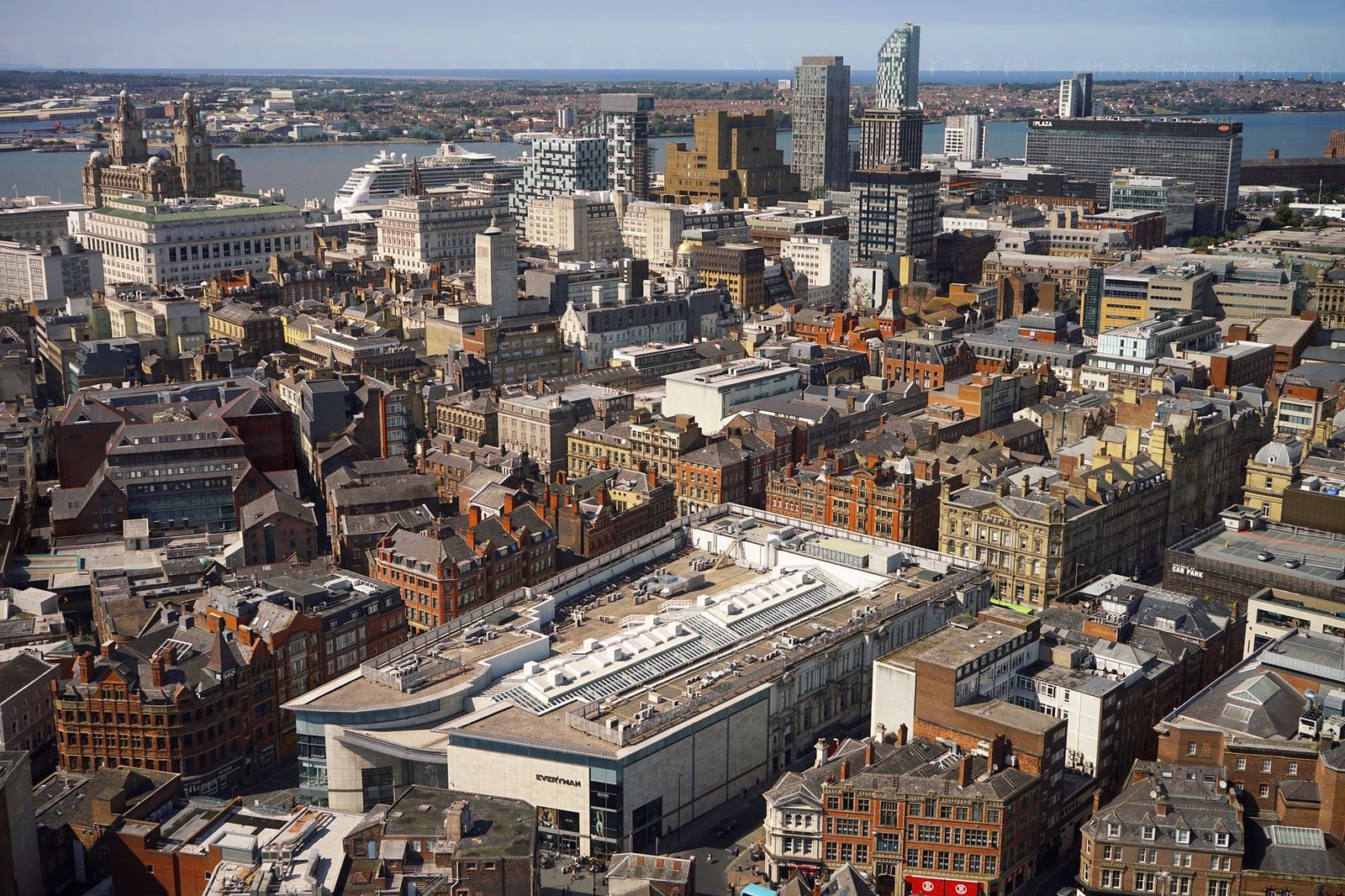 A stunning aerial view of Liverpool's skyline featuring historic architecture and the waterfront.