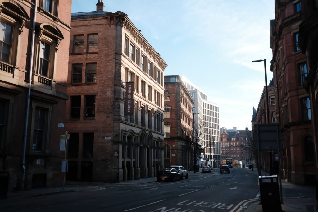 Daytime street view of urban architecture in Manchester city center.