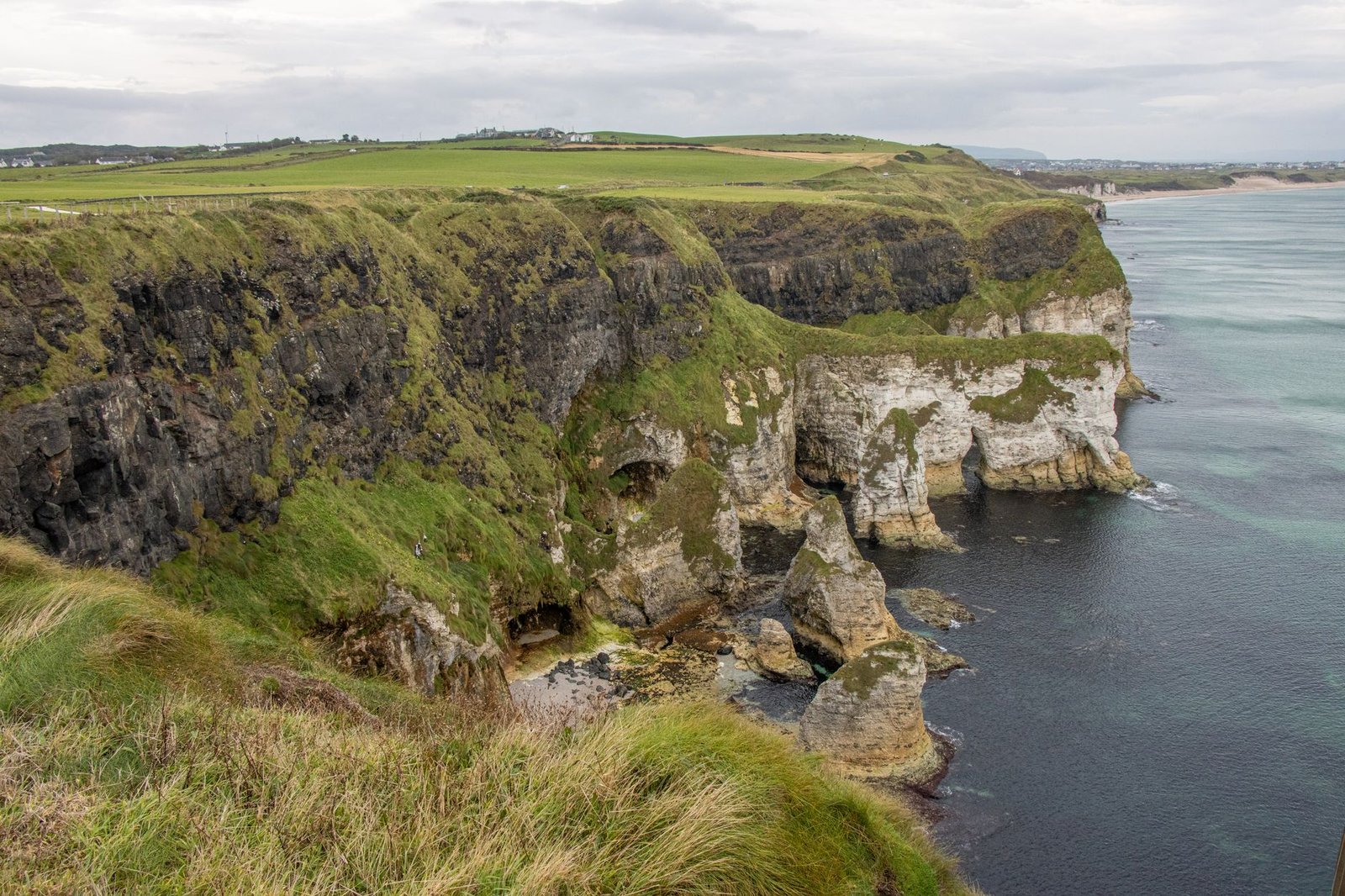 Dramatic coastal cliffs and lush green landscapes along Ballintoy, Northern Ireland.