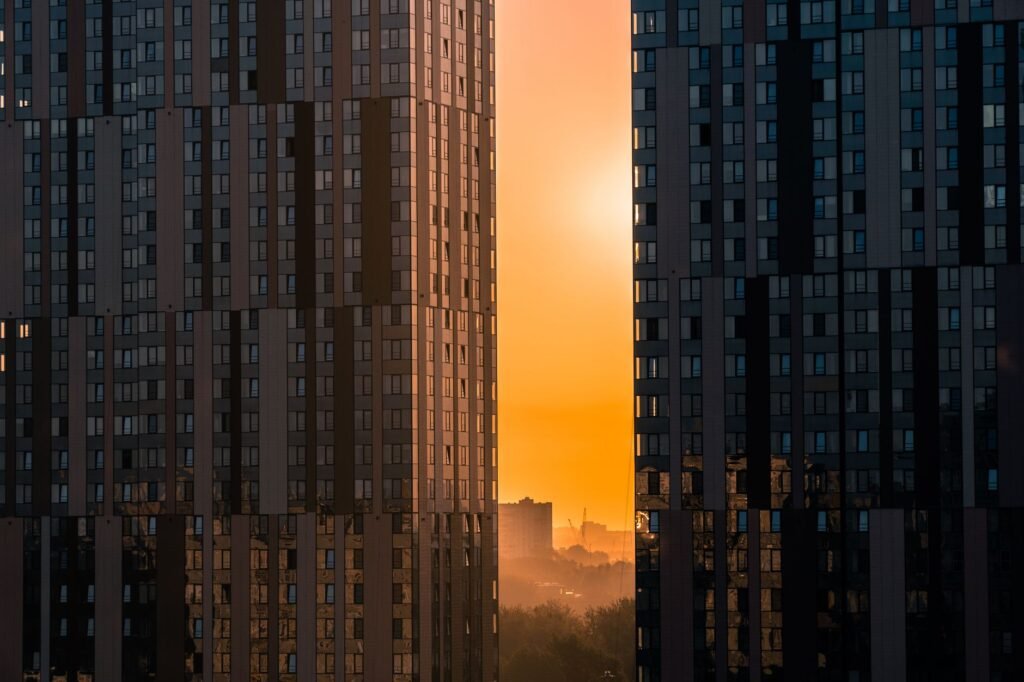 A dramatic view of Moscow city towers silhouetted against a vibrant sunset.