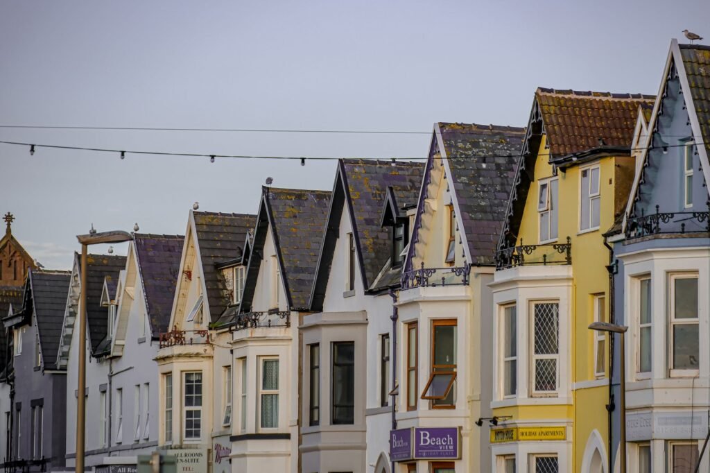 Colorful row houses in Blackpool, showcasing Edwardian architecture during a serene day.