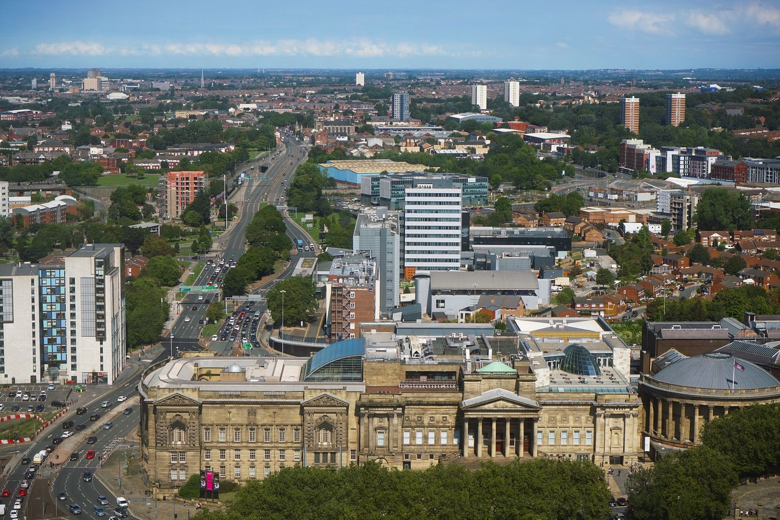 Explore the bustling cityscape of Liverpool showcasing its iconic architecture and vibrant urban life.