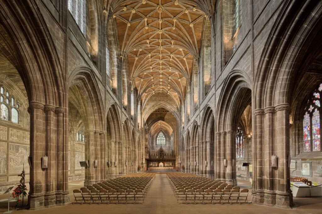 Capture the breathtaking gothic architecture of Chester Cathedral's nave, showcasing its intricate arches and historic charm.
