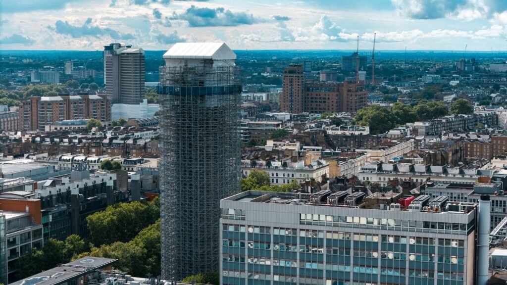 A scenic aerial view of London's skyline featuring urban architecture and a building under renovation.