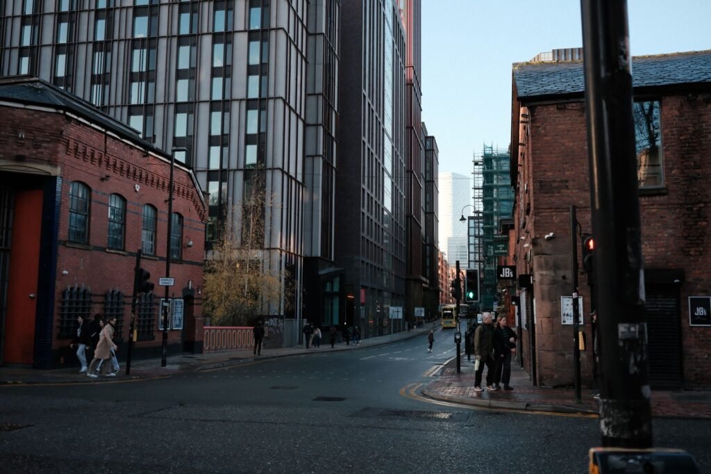 Street view showcasing a blend of historic and modern architecture with pedestrians.