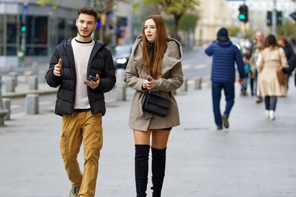 couple, walking, street, urban, sidewalk, pavement, together, phones, casual, winter, street photography, people