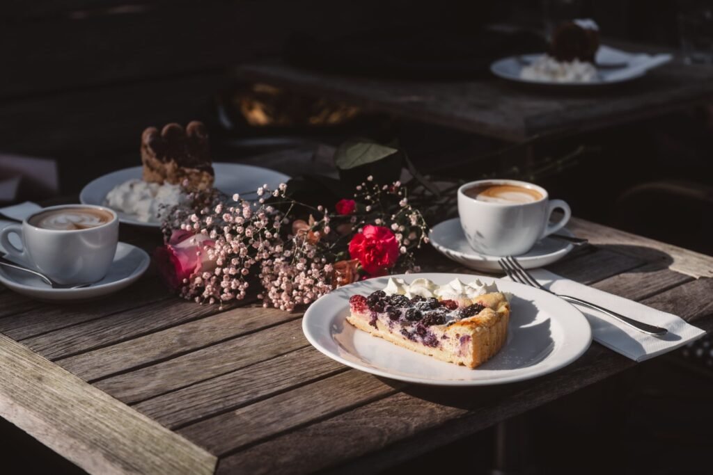 A delightful outdoor café scene featuring coffee and a berry tart, perfect for a serene fall afternoon.