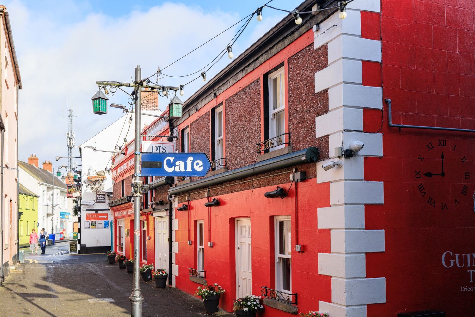 Charming red-walled cafe street in Carlingford, County Louth, Ireland.