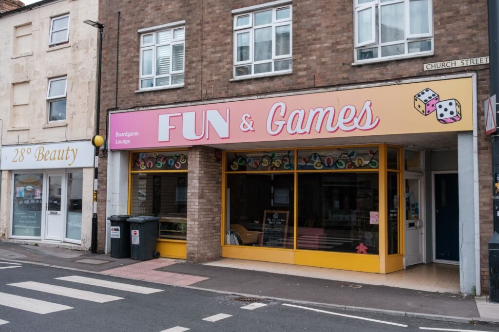 Exterior view of a colorful boardgame lounge called FUN & Games on Church Street.