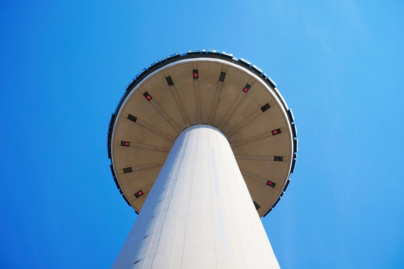 Dynamic low angle shot of St. John's Beacon against a clear blue sky in Liverpool.