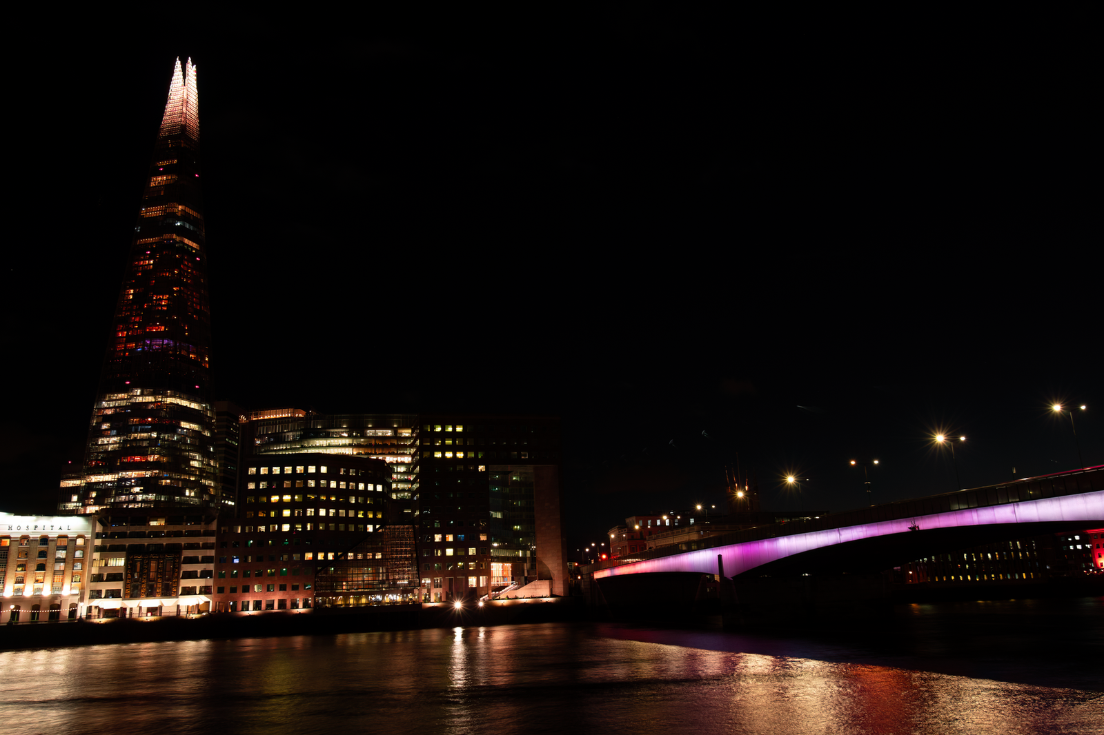 Night view of The Shard and illuminated London Bridge over River Thames