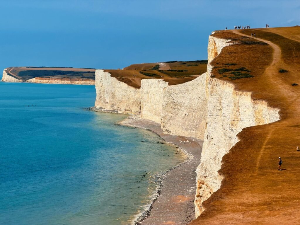 Breathtaking panoramic view of the iconic Seven Sisters cliffs along the English coastline.