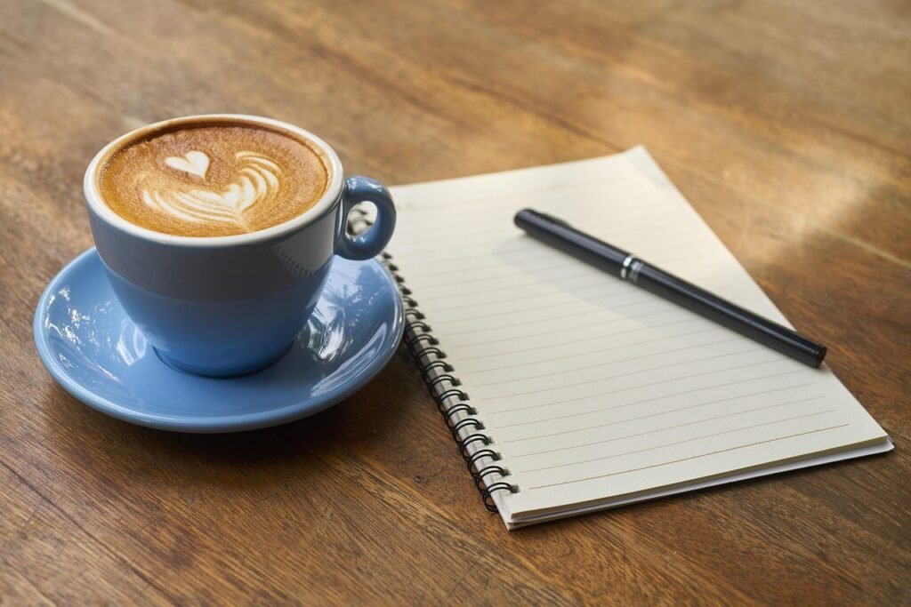 coffee, pen, notebook, open notebook, empty notebook, caffeine, cup, cafe, coffee cup, latte, latte art, cappuccino, morning
