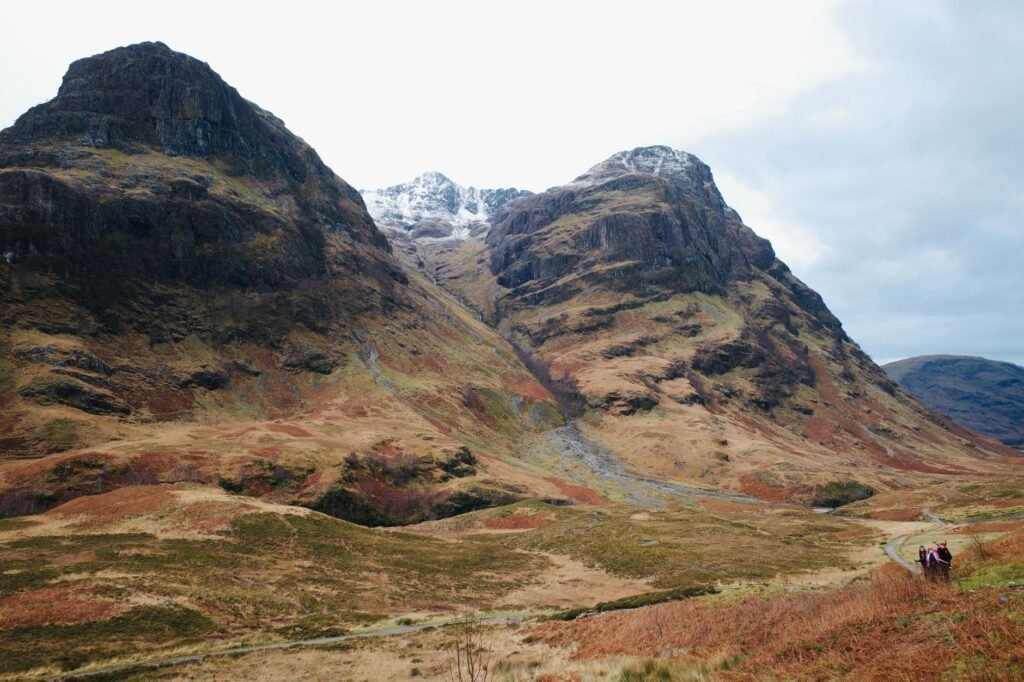 Stunning view of the Three Sisters mountains in Glencoe, Scotland, showcasing dramatic natural beauty.