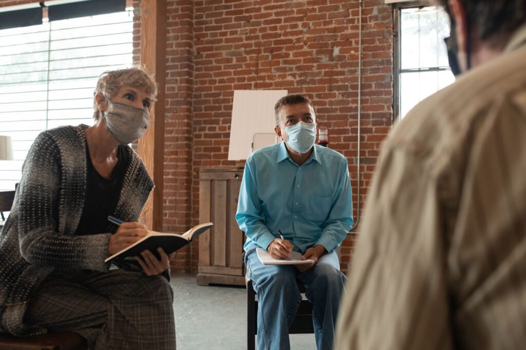 Two adults having a relaxed and attentive conversation