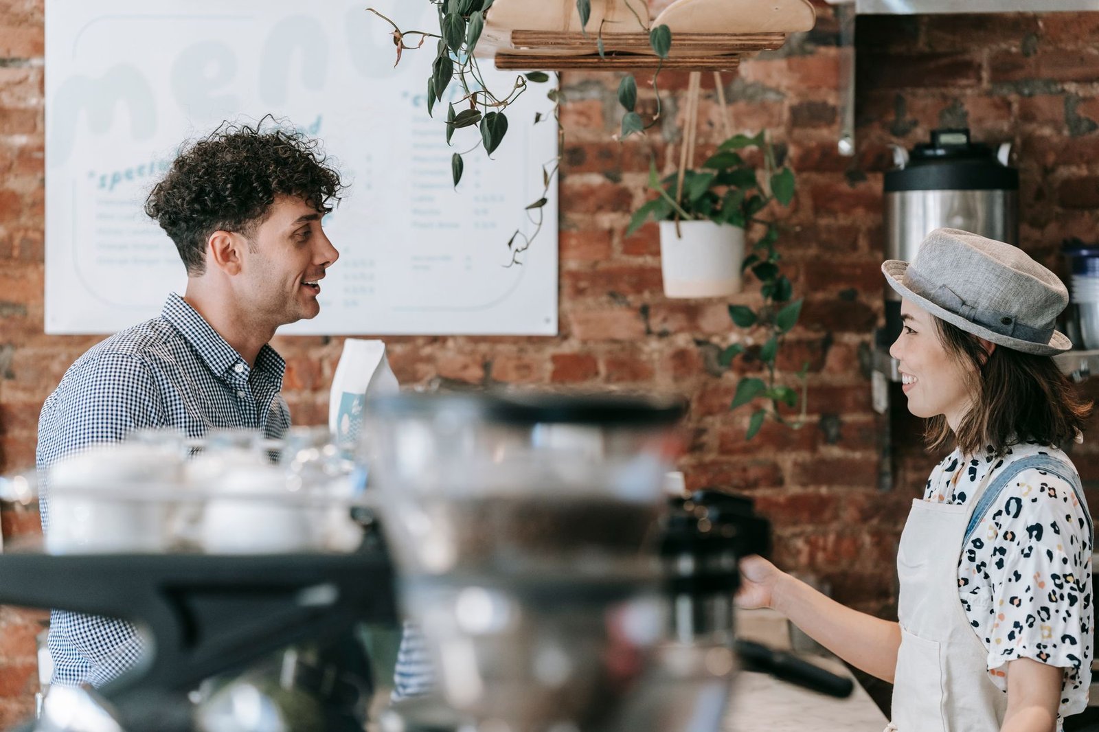 Two adults exchanging a relaxed greeting before a meeting
