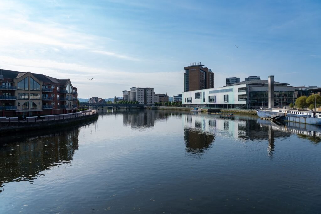 Peaceful riverside view of modern and classic architecture in Dublin, Ireland.