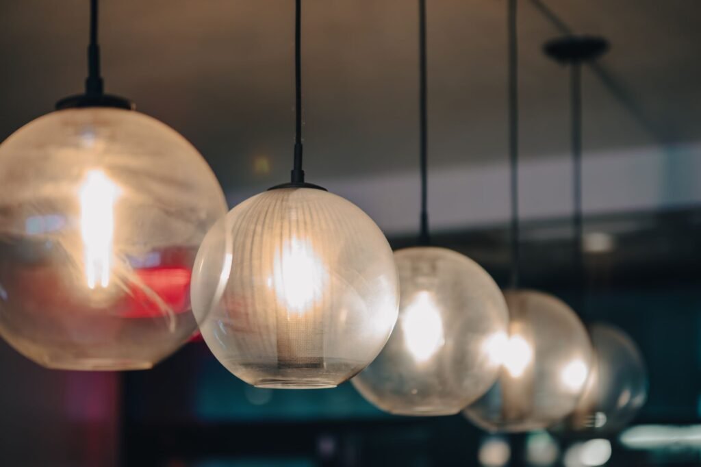 Elegant round pendant lights add a warm glow to a New York restaurant interior.