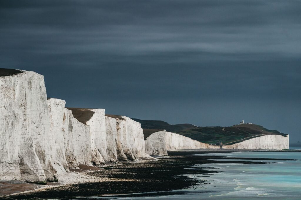 Captivating view of the iconic Seven Sisters sea cliffs along the English coastline on a moody day.