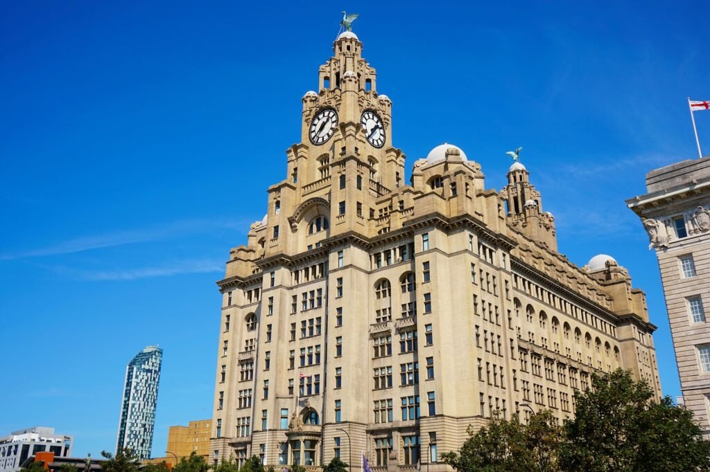 The Royal Liver Building under a clear blue sky in Liverpool, England.