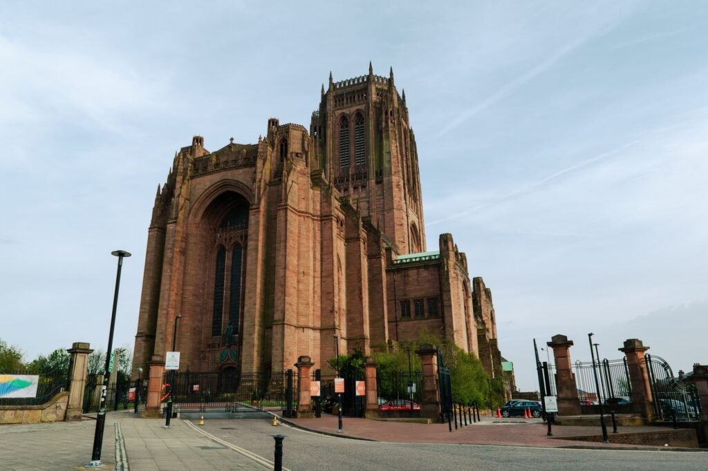Impressive view of Liverpool Cathedral's gothic revival architecture from the street.