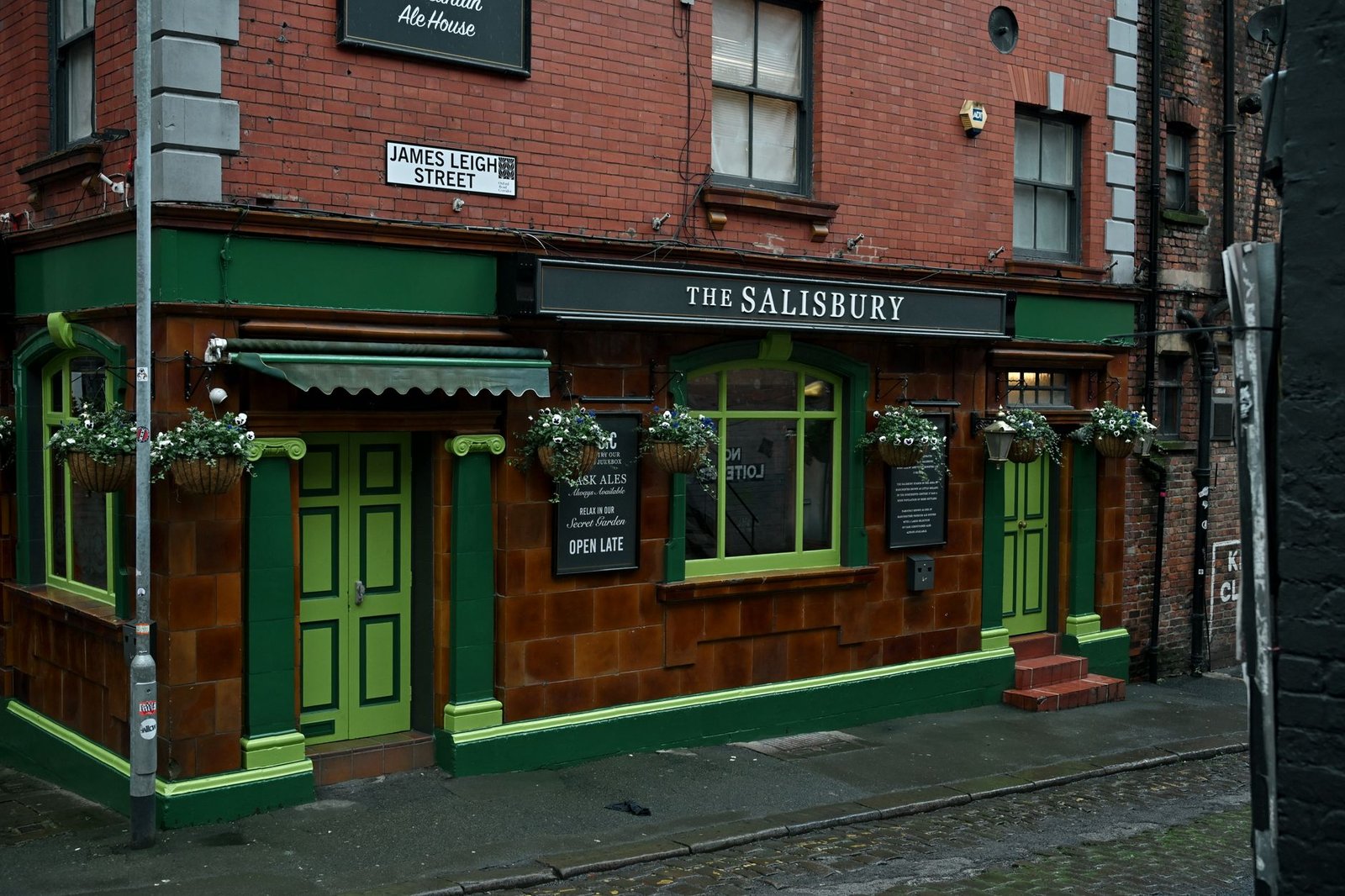 Exterior view of the Salisbury Pub with vibrant green accents on James Leigh Street.