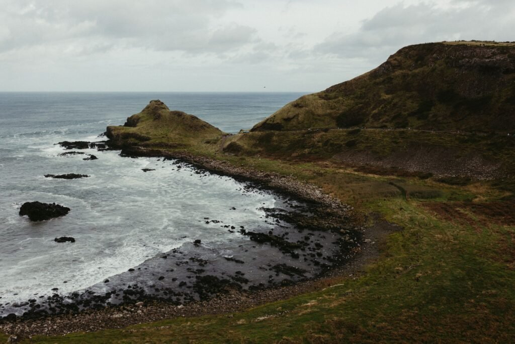 A breathtaking view of Giant's Causeway's rugged coastline and dramatic cliffs in Northern Ireland.