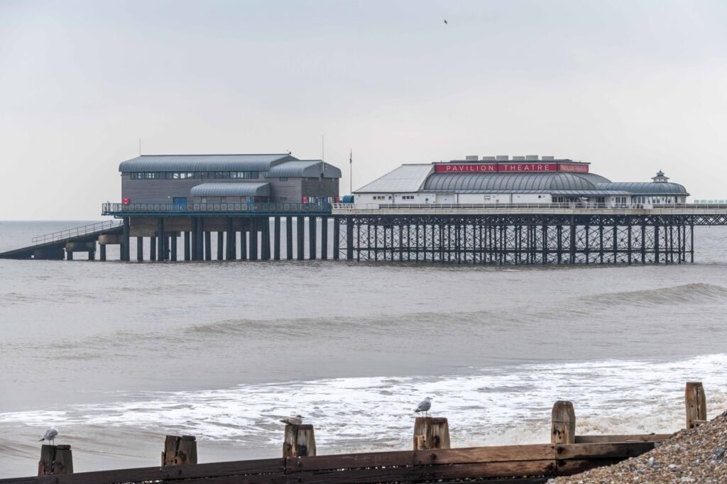 Iconic Cromer Pier with Pavilion Theatre by the sea in Cromer, Norfolk, England.